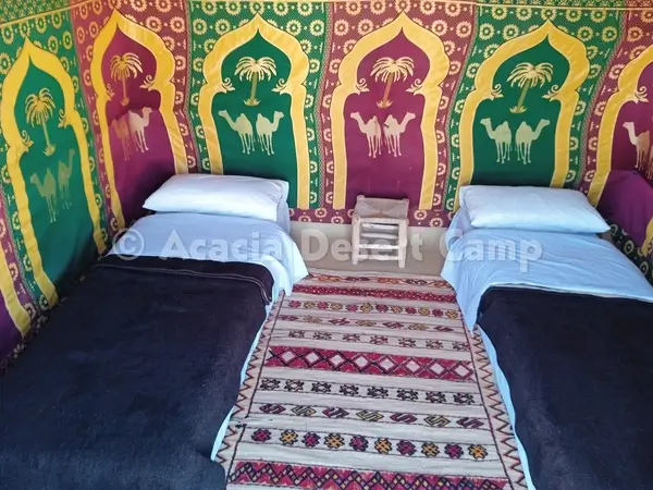 Twin bed in Merzouga desert camp